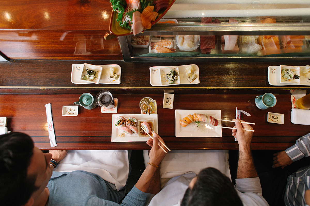 couple eating sushi at the sushi bar